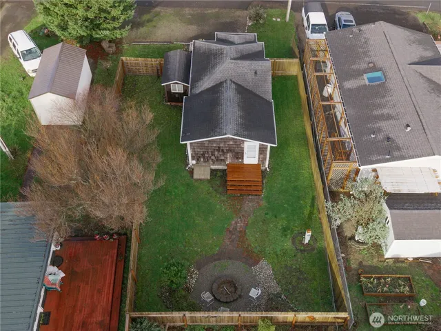 an aerial view of residential houses with outdoor space