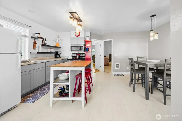 a view of a kitchen and dining room