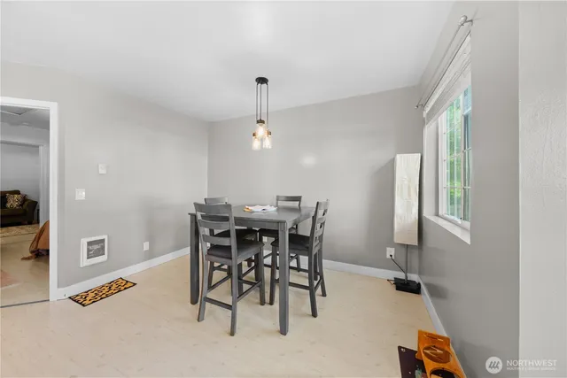 a view of a dining room with furniture