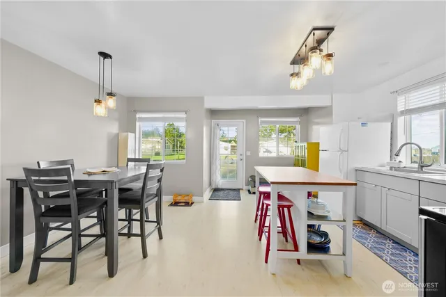 a view of a dining room with furniture and window