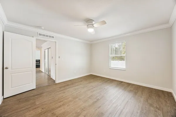 a bathroom with a bathtub a shower a sink and a window