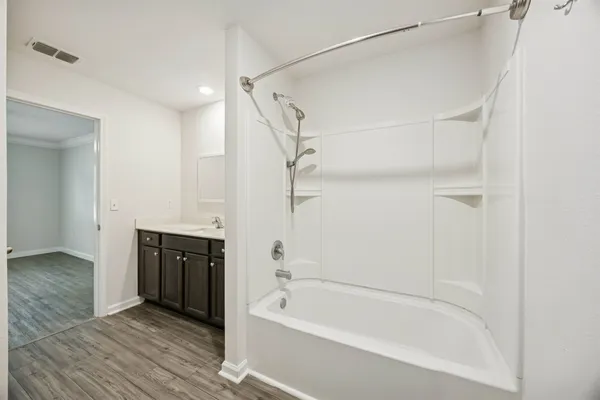 a white toilet sitting next to a bathroom sink