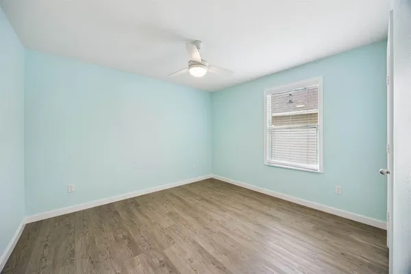 a bathroom with a sink toilet tub vanity and shower