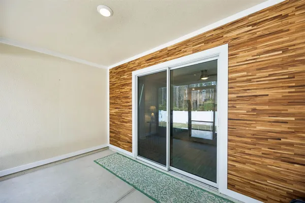 a view of a house with backyard porch and sitting area
