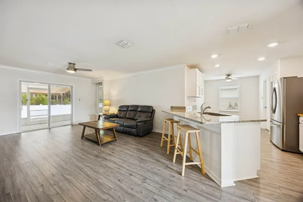 a living room with furniture and a window