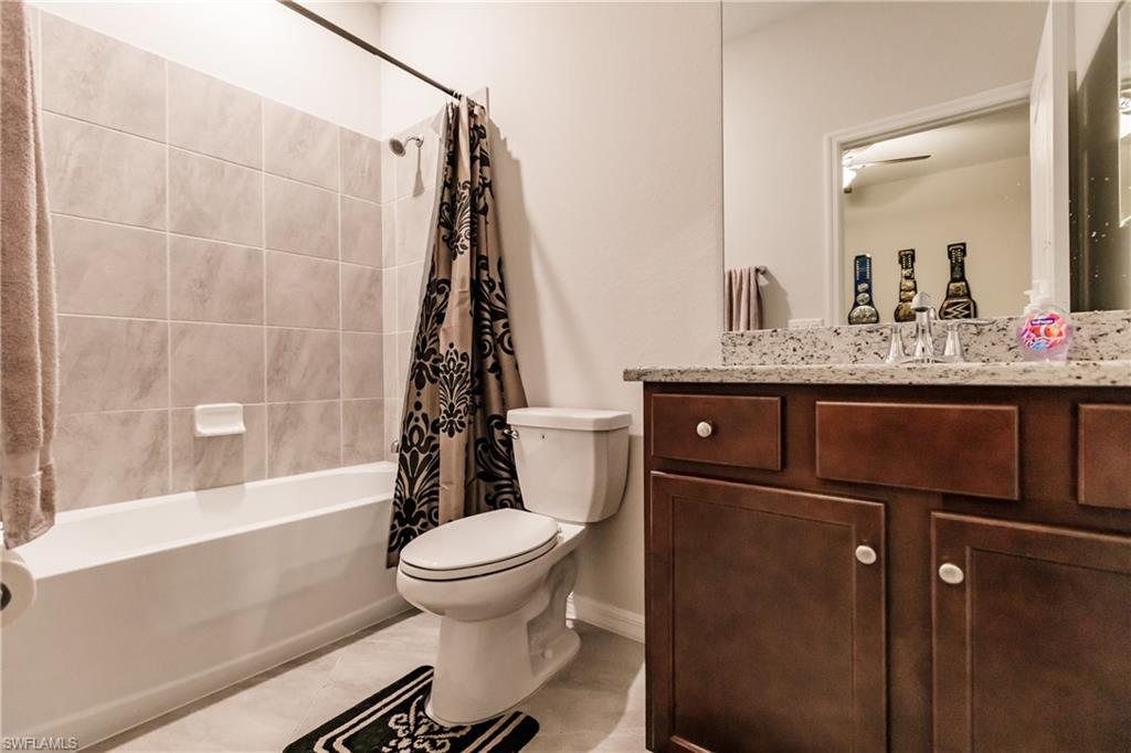 2247 Dancy Street Naples, FL 34120 - Photo 19 of 32 a bathroom with a sink a toilet and shower