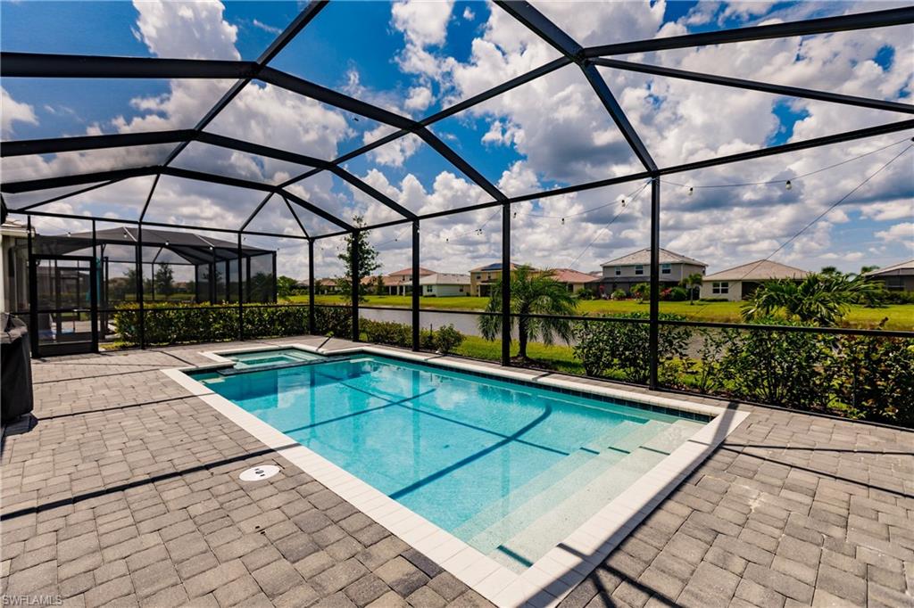 2247 Dancy Street Naples, FL 34120 - Photo 26 of 32 a view of a swimming pool with a patio