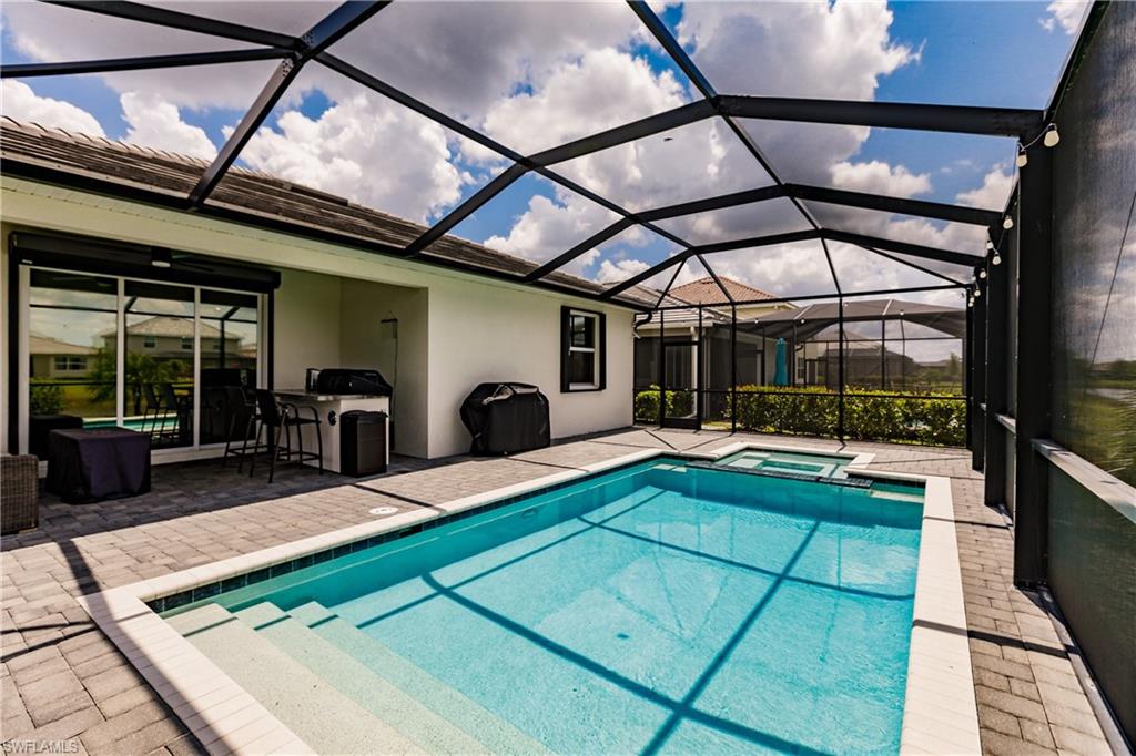 2247 Dancy Street Naples, FL 34120 - Photo 27 of 32 a view of swimming pool with seating area