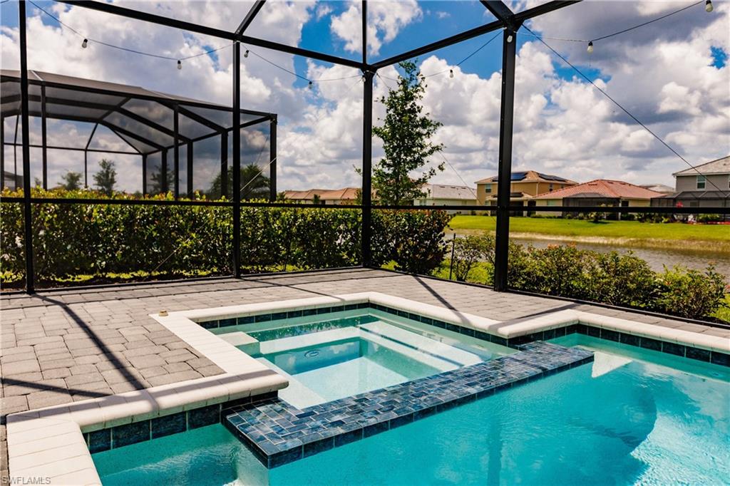 2247 Dancy Street Naples, FL 34120 - Photo 28 of 32 a view of a patio with a table chairs