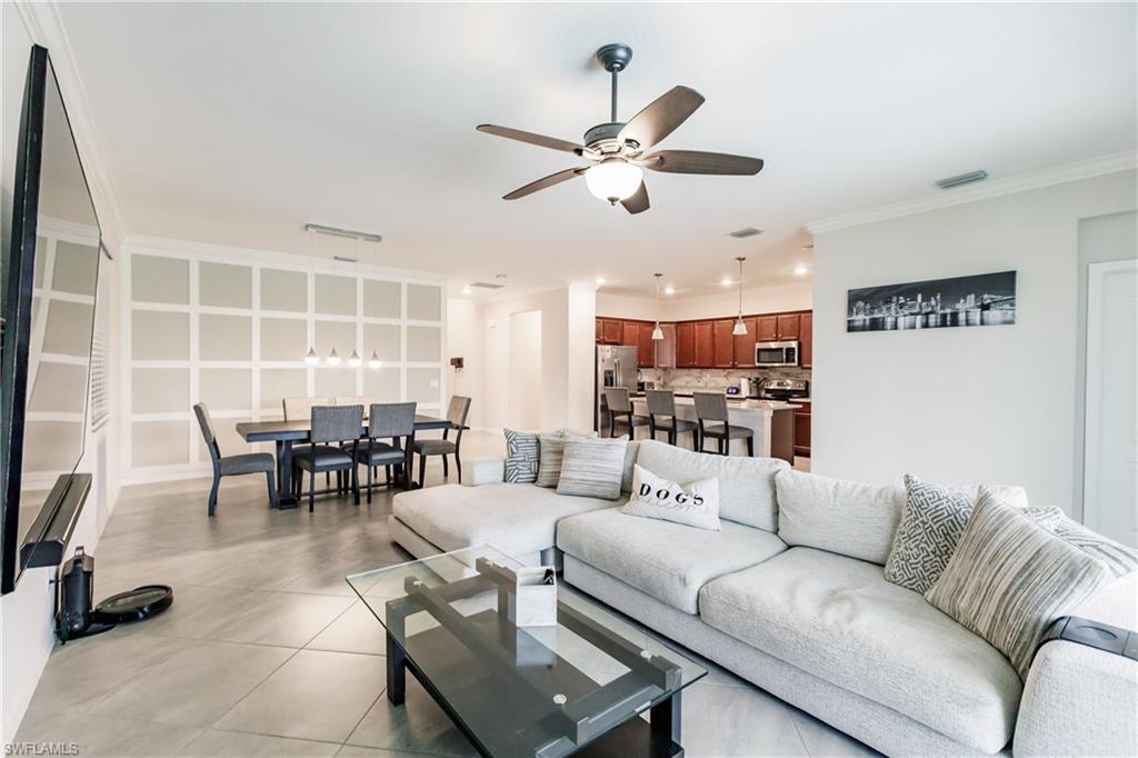 2247 Dancy Street Naples, FL 34120 - Photo 8 of 32 a living room with furniture and a view of kitchen