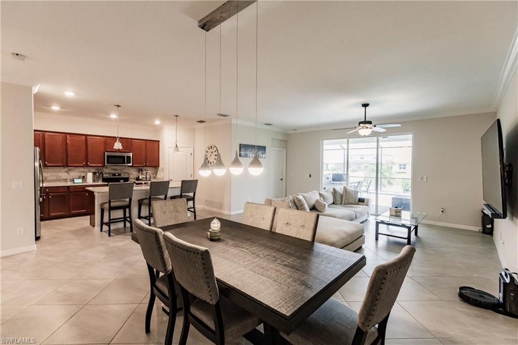 2247 Dancy Street Naples, FL 34120 - Photo 10 of 32 a view of a dining room with furniture