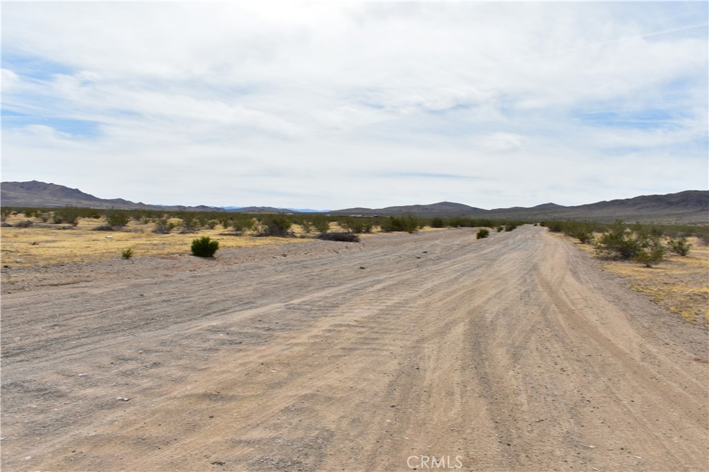 0 Frontier Road Helendale, CA 92342 - Photo 5 of 9 a view of an ocean beach and mountain