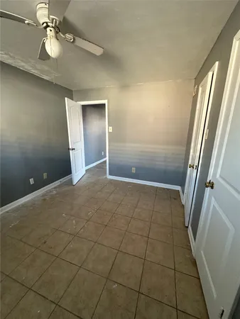 wooden floor in an empty room with a mirror