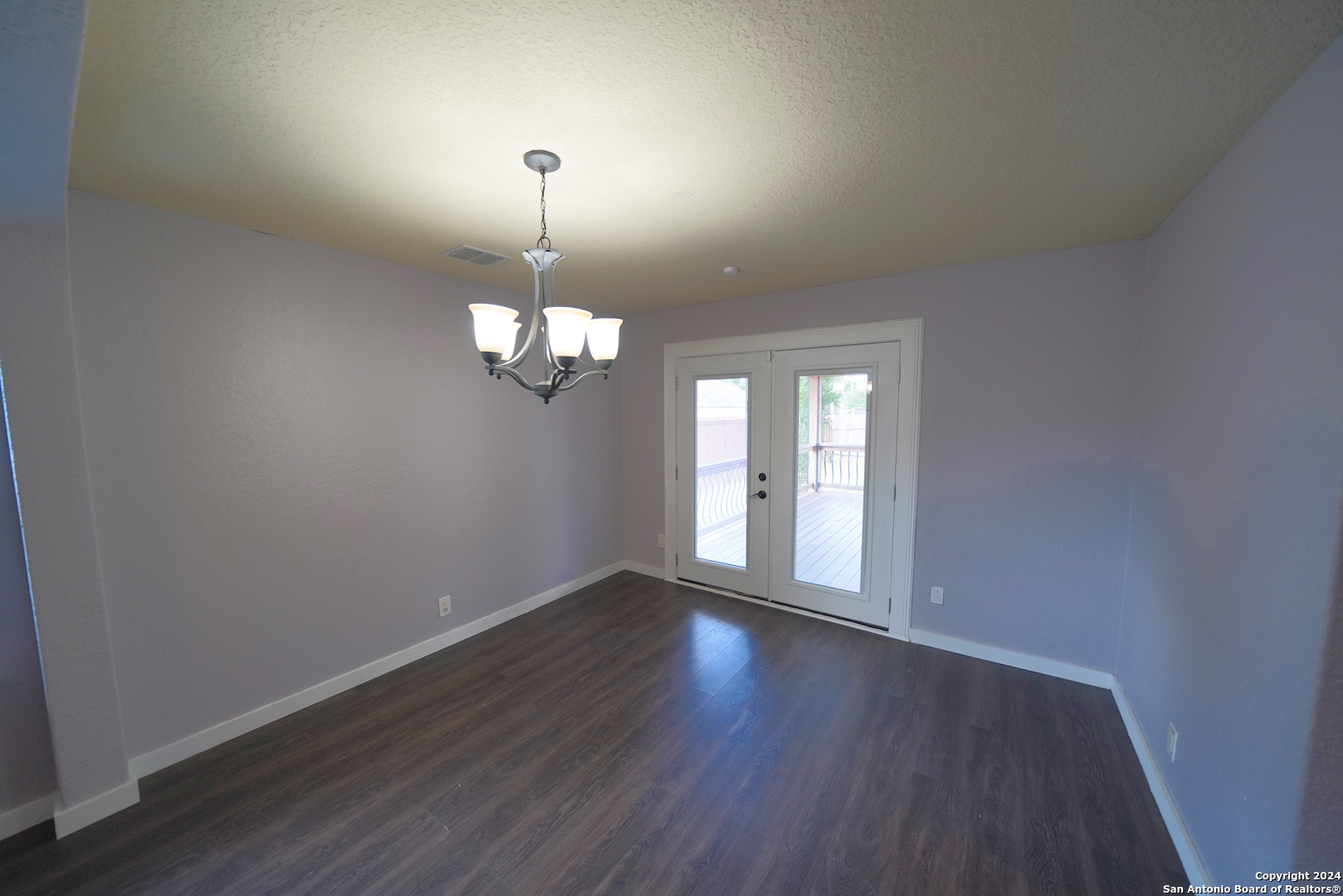 523 Diana Drive Converse, TX 78109 - Photo 11 of 50 a view of empty room with wooden floor and fan