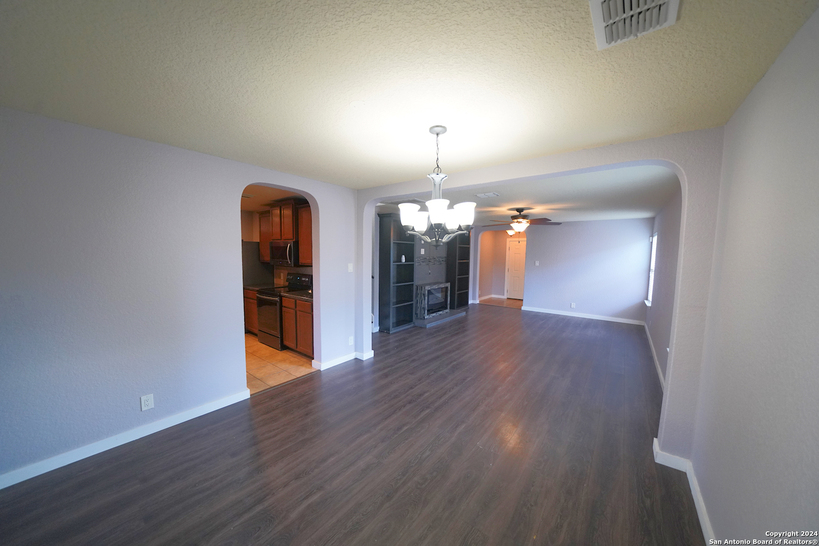 523 Diana Drive Converse, TX 78109 - Photo 14 of 50 wooden floor in an empty room with a window