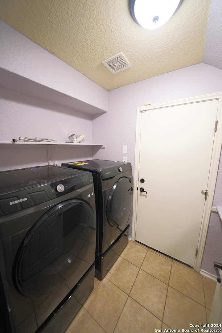 523 Diana Drive Converse, TX 78109 - Photo 20 of 50 a utility room with dryer and washer