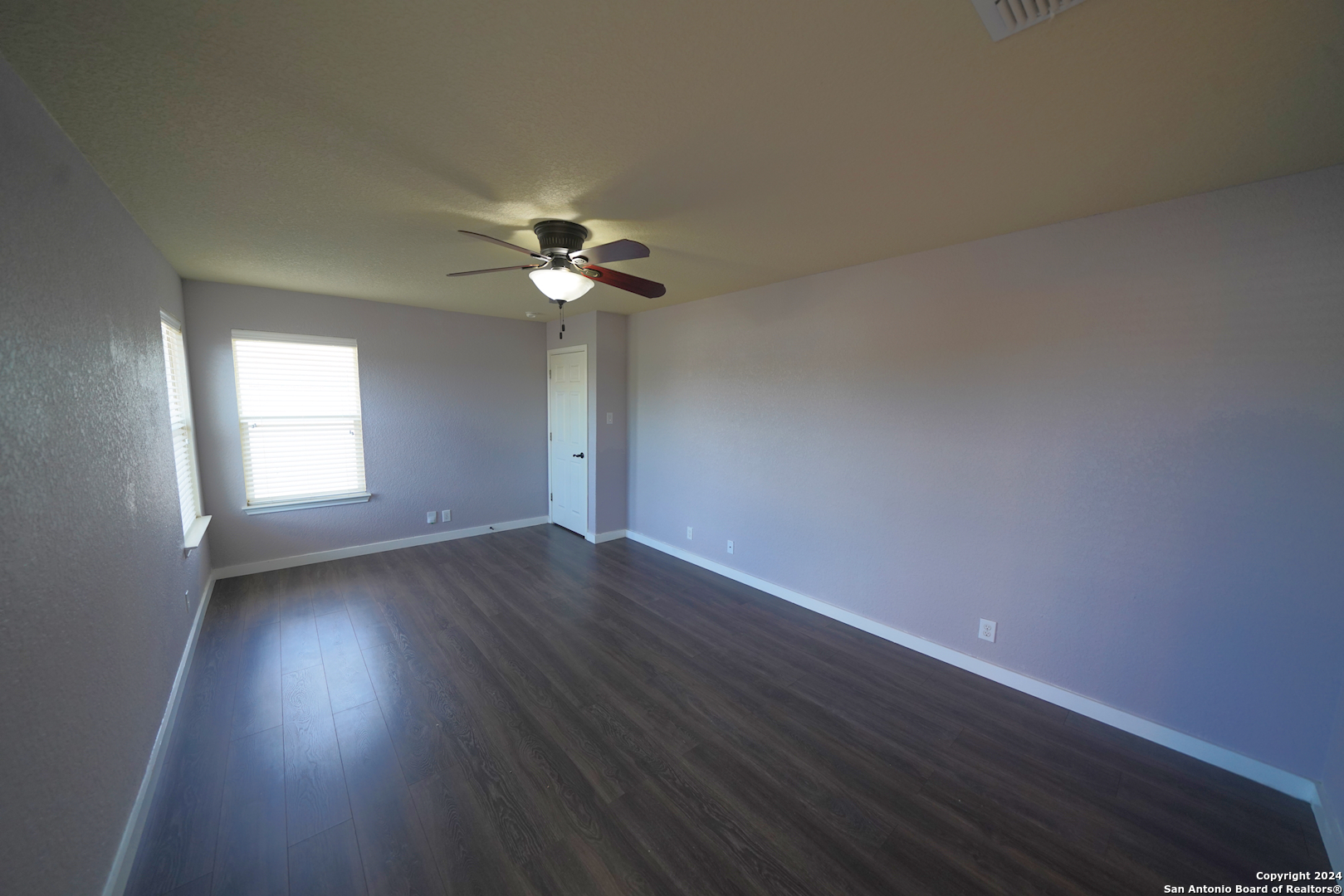 523 Diana Drive Converse, TX 78109 - Photo 23 of 50 a view of an empty room with a window and wooden floor