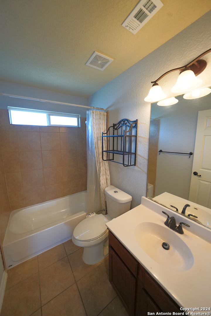 523 Diana Drive Converse, TX 78109 - Photo 37 of 50 a bathroom with a sink a toilet and shower