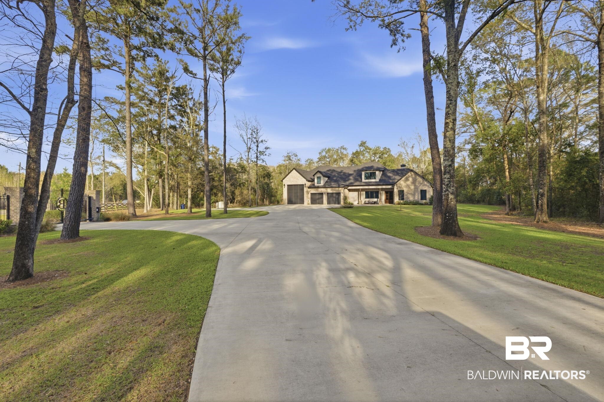 9501 Ben Hamilton Road Theodore, AL 36582 - Photo 5 of 69 View of front facade featuring a front lawn and driveway