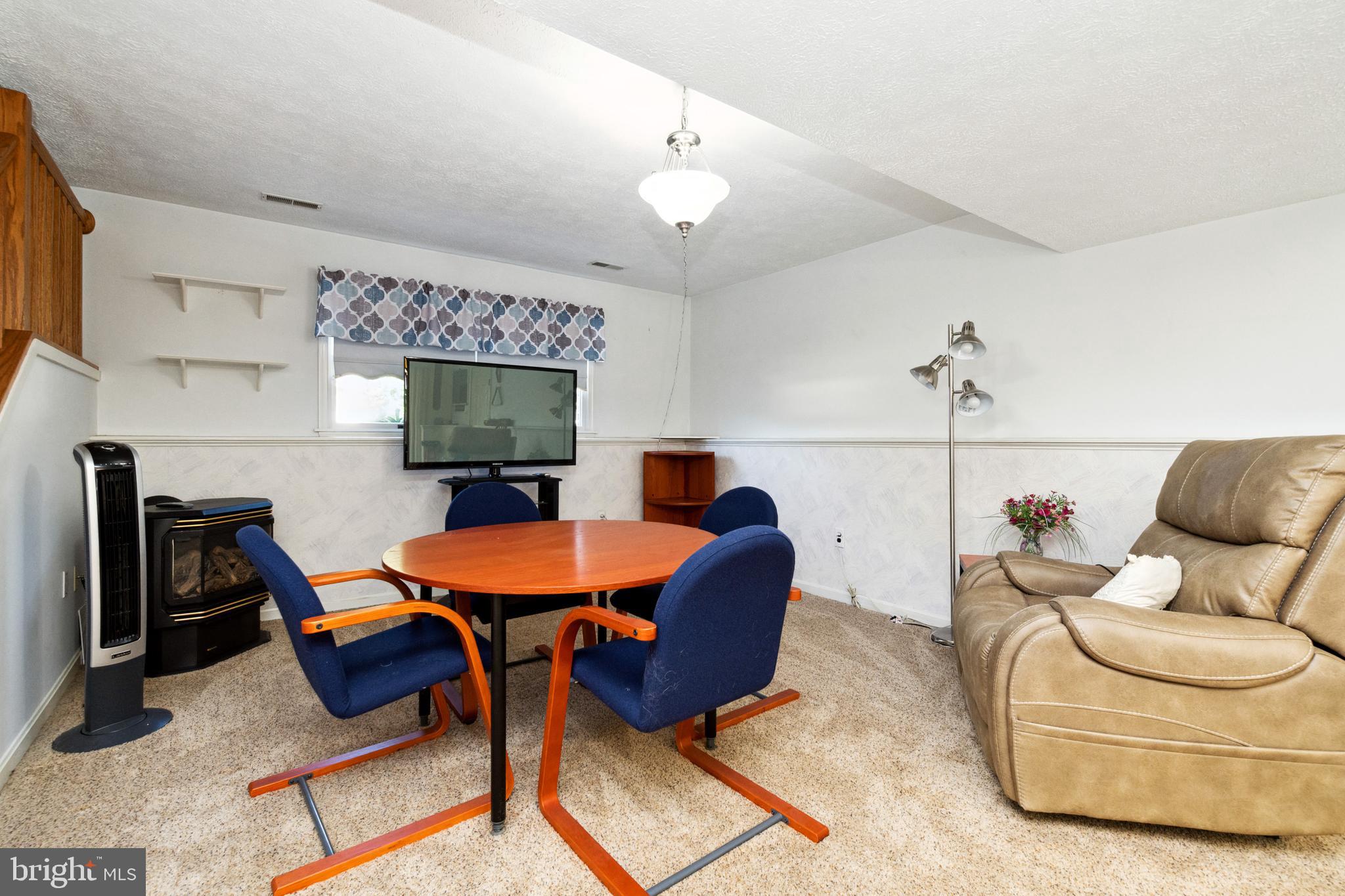 7815 Linthicum Road Pasadena, MD 21122 - Photo 15 of 48 Family Room with Gas Heater