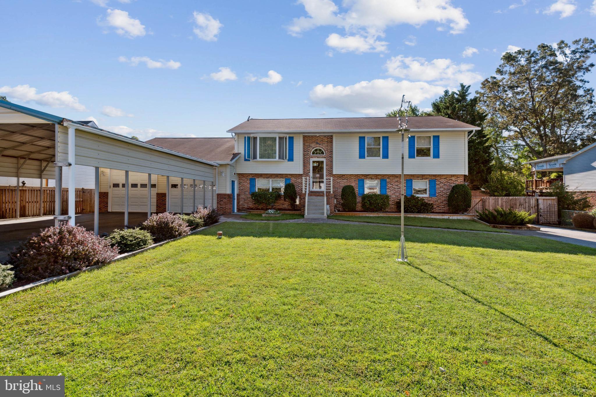 Front  showing attached garage &  covered driveway