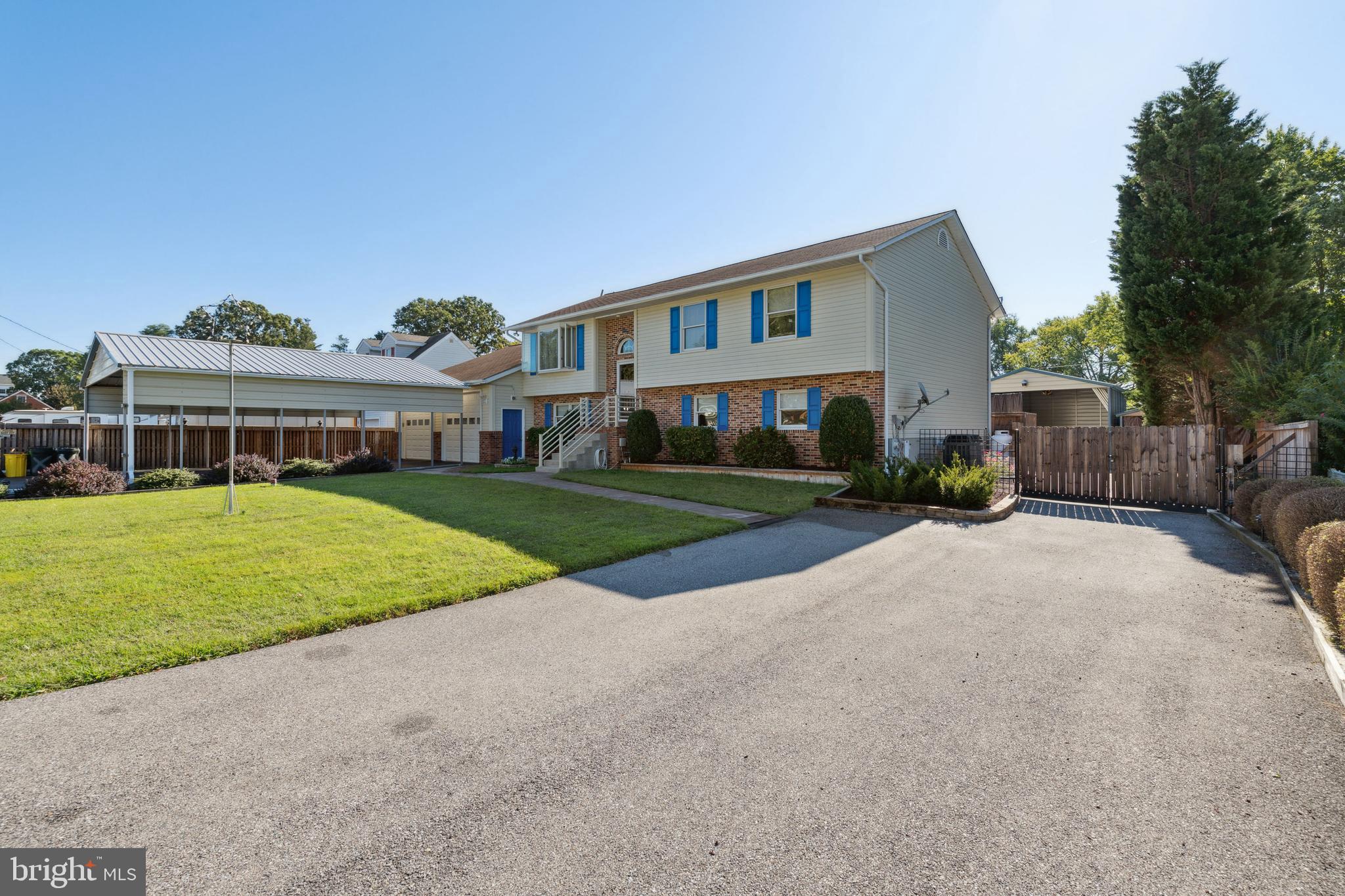 Second driveway leading to rear yard