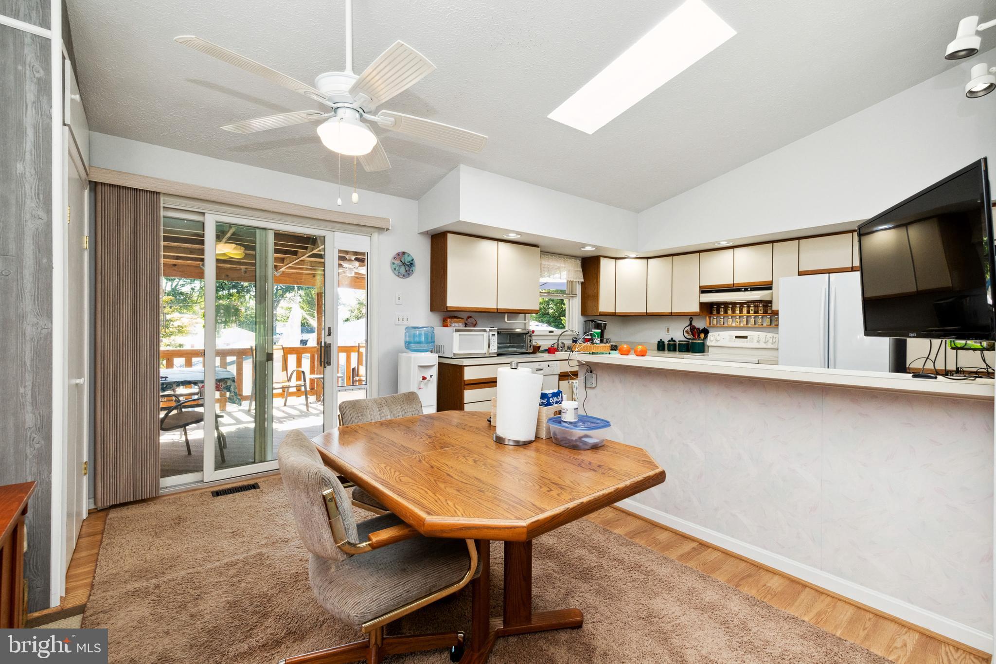 7815 Linthicum Road Pasadena, MD 21122 - Photo 10 of 48 Dining Area Leads to Covered Deck