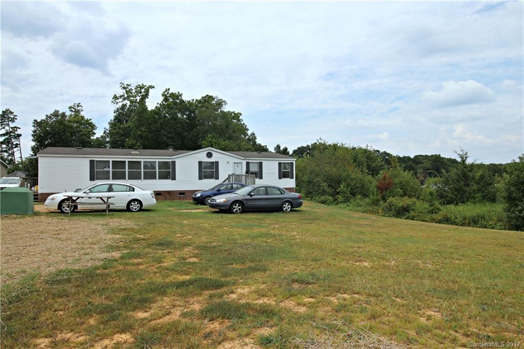 34927 Finger Road Mount Pleasant, NC 28124 - Photo 1 of 19 a front view of a house with garden