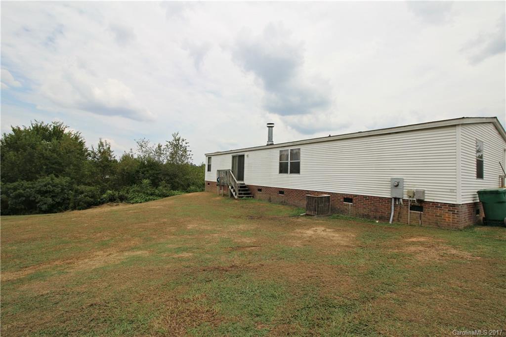 34927 Finger Road Mount Pleasant, NC 28124 - Photo 2 of 19 a backyard of a house with table and chairs