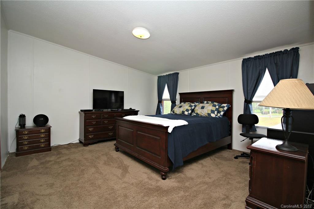 34927 Finger Road Mount Pleasant, NC 28124 - Photo 11 of 19 a bedroom with a bed and a television