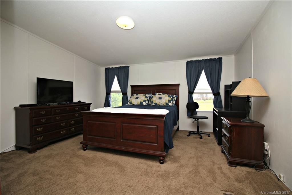 34927 Finger Road Mount Pleasant, NC 28124 - Photo 14 of 19 a room with furniture and a flat screen tv
