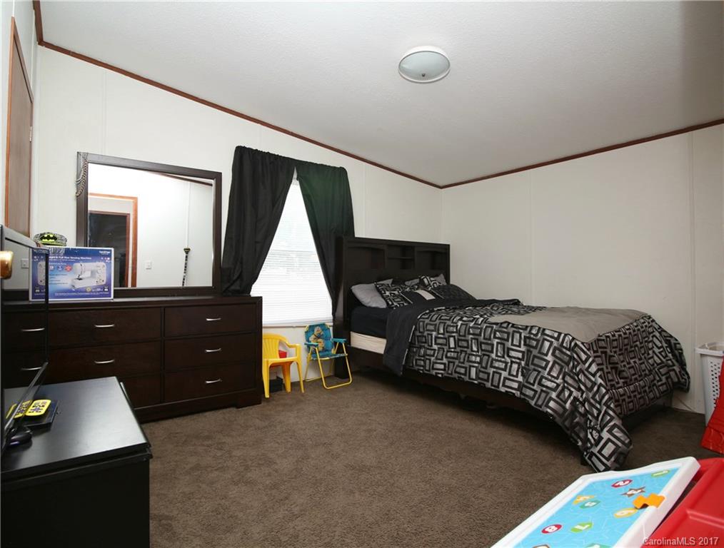34927 Finger Road Mount Pleasant, NC 28124 - Photo 15 of 19 a bedroom with a bed and a dresser