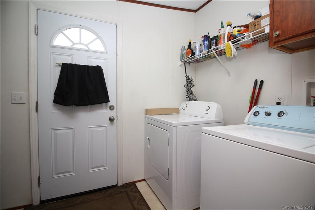 34927 Finger Road Mount Pleasant, NC 28124 - Photo 18 of 19 a view of storage and utility room with dryer and washer