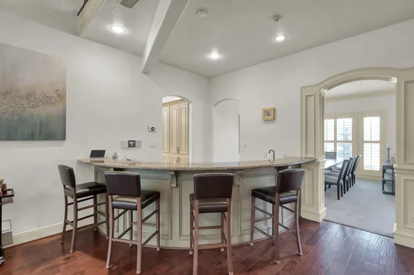 a view of a a dining room with furniture window and wooden floor