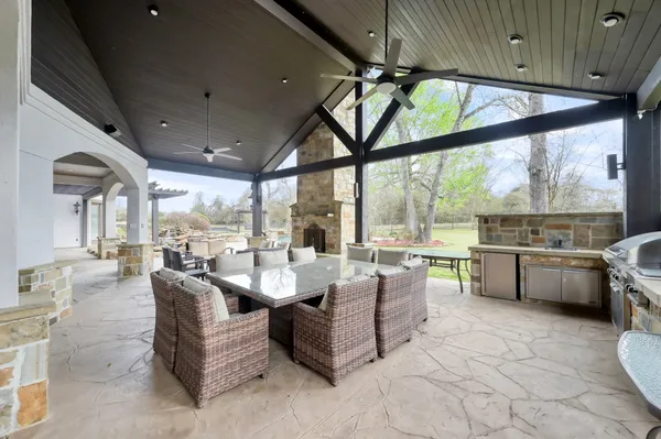 a living room with furniture and a floor to ceiling window