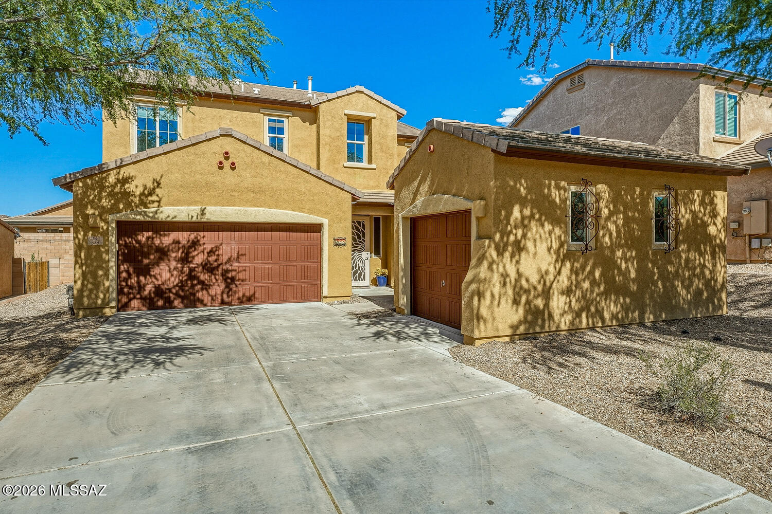 323 East Refuge Loop Vail, AZ 85641 - Photo 2 of 51 a front view of a house with garden