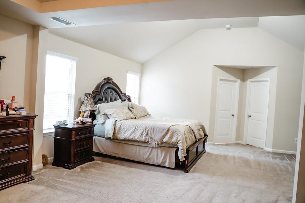 3830 Kittery Point Southwest Snellville, GA 30039 - Photo 32 of 35 a bedroom with a bed and a window