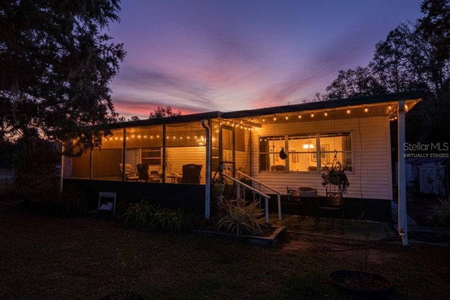 240 Kitty Avenue Interlachen, FL 32148 - Photo 3 of 44 a view of swimming pool with outdoor seating and yard in the back