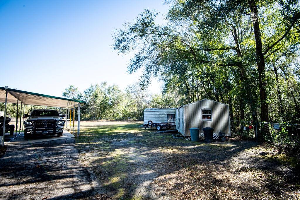 240 Kitty Avenue Interlachen, FL 32148 - Photo 32 of 44 a view of a house with backyard and garden