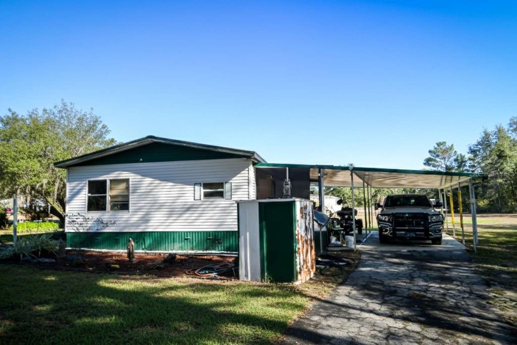 240 Kitty Avenue Interlachen, FL 32148 - Photo 44 of 44 a view of a house with backyard and porch