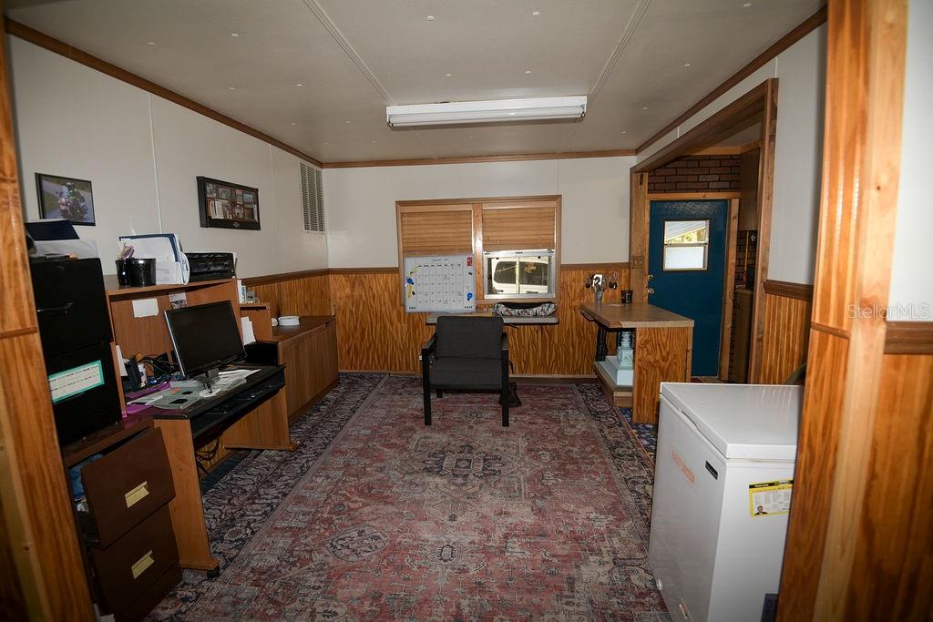 240 Kitty Avenue Interlachen, FL 32148 - Photo 8 of 44 a living room with furniture a window and a flat screen tv