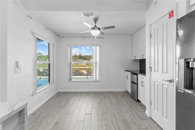 an empty room with wooden floor and closet