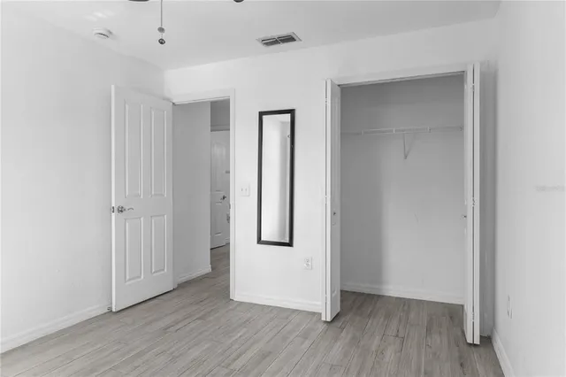 an aerial view of residential houses with outdoor space and swimming pool