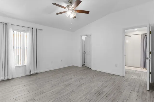 an aerial view of a house with a lake view