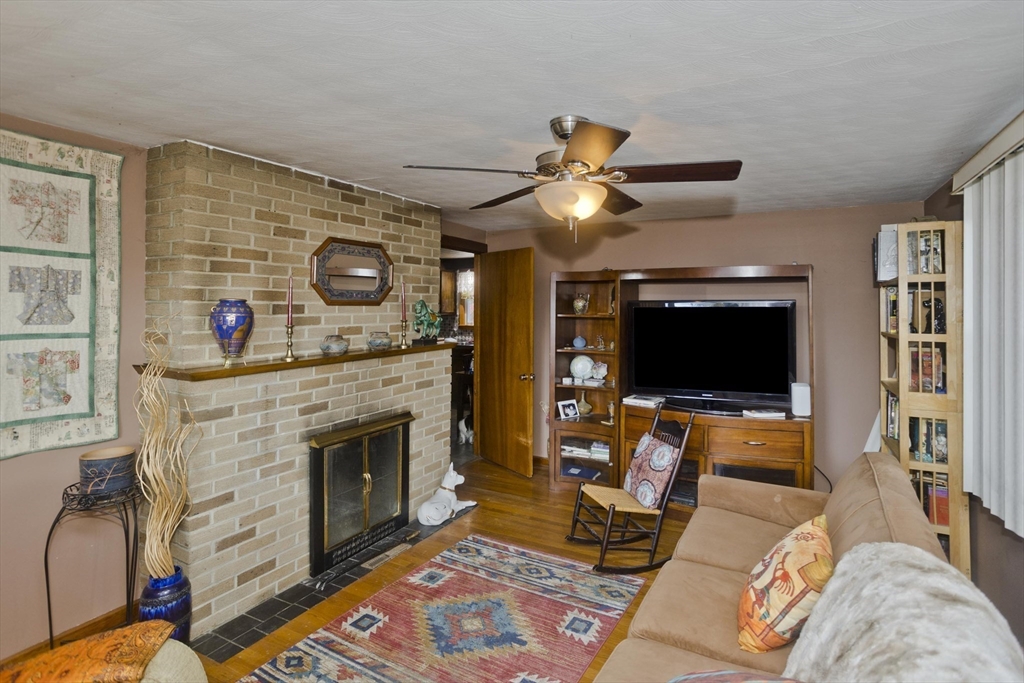 27 Regal Street Springfield, MA 01118 - Photo 11 of 32 a living room with furniture and a flat screen tv