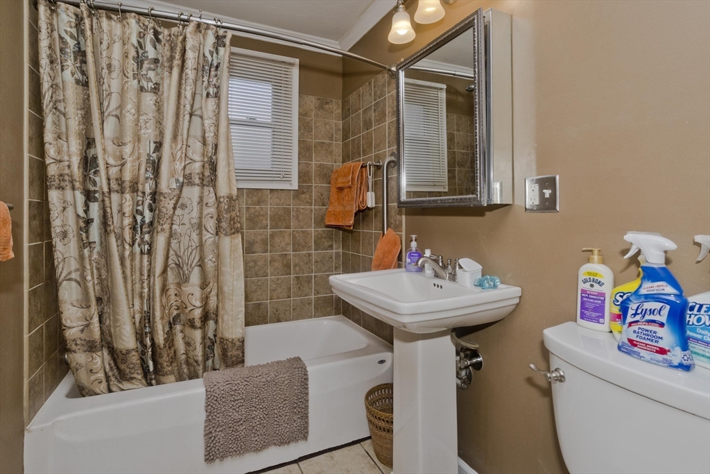27 Regal Street Springfield, MA 01118 - Photo 15 of 32 a bathroom with a sink toilet and shower