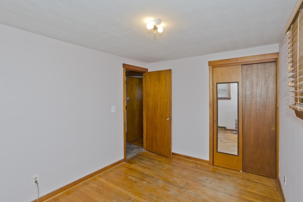 27 Regal Street Springfield, MA 01118 - Photo 18 of 32 a view of an empty room with wooden floor