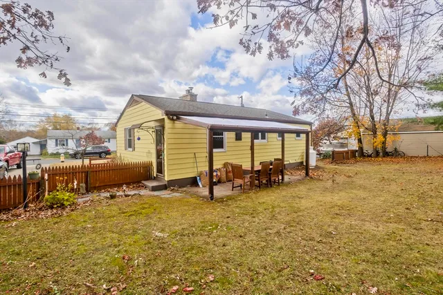 a view of a house with backyard porch and sitting area