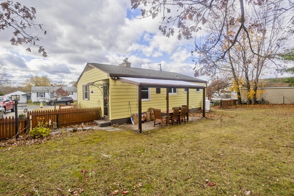 27 Regal Street Springfield, MA 01118 - Photo 3 of 32 a view of a house with backyard porch and sitting area