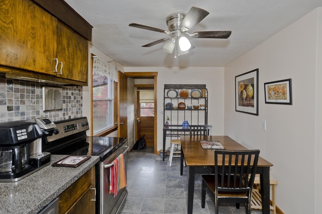 27 Regal Street Springfield, MA 01118 - Photo 9 of 32 a view of a dining room with furniture and a kitchen